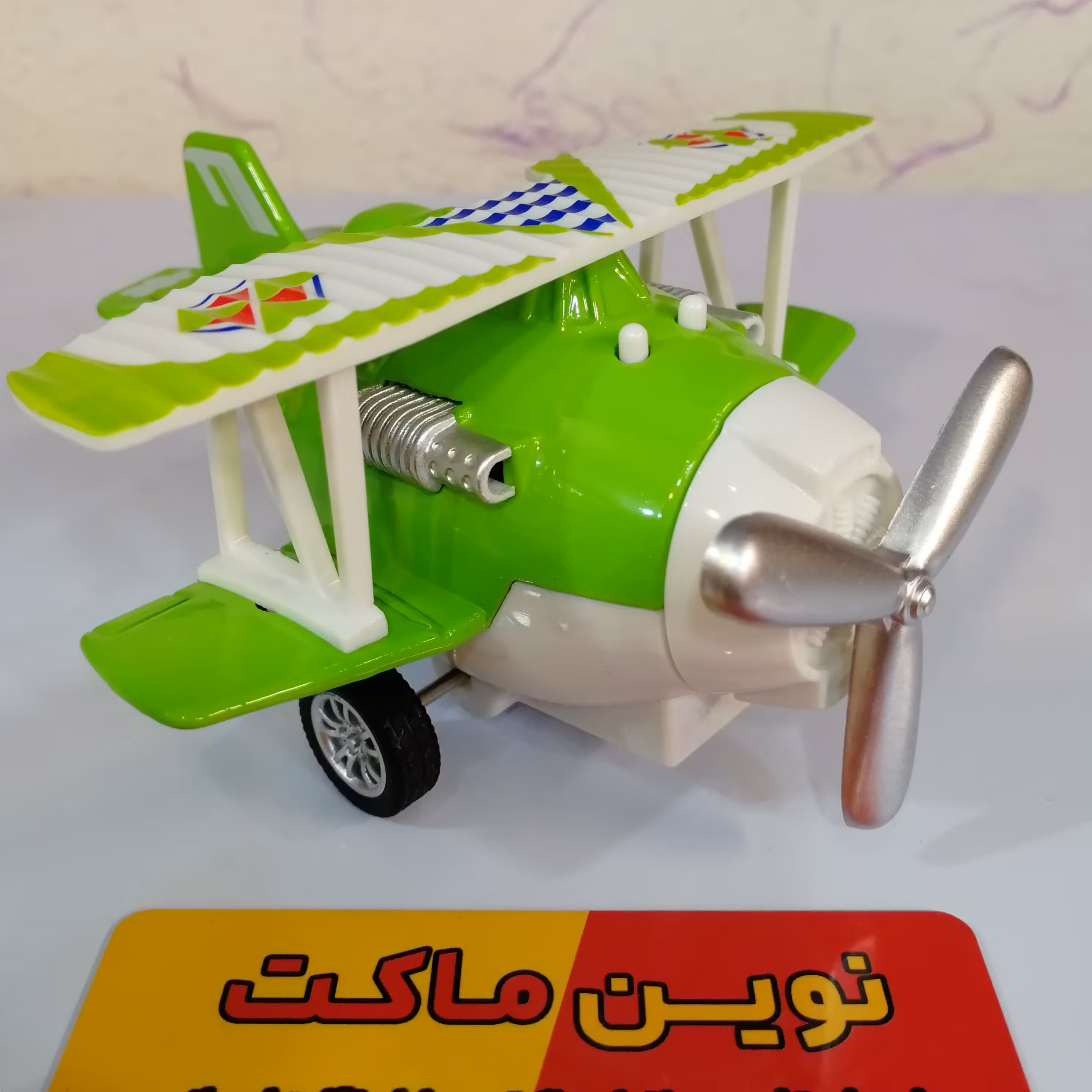 هواپیما فلزی فانتزی موزیکال پره چرخان عقبکش حدود طول 10 سانتی متر رنگ سبز