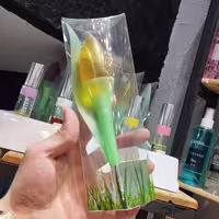عطر و ادکلن رکسان زنانه طرح گل لاله بار ایحه تری درمس 