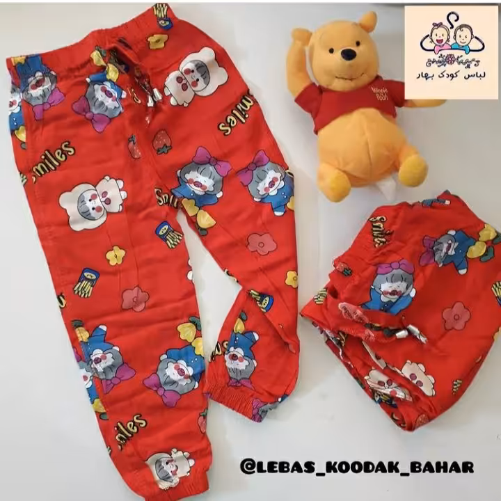 شلوار نخی تمام چاپ دخترانه تکرنگ قرمز، قد 75 سانت