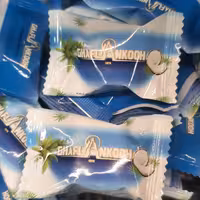 شکلات نارگیلی قافلاکوه  آجیل و خشکبار بادامک 