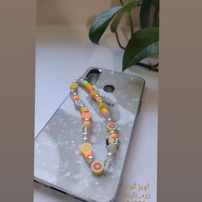 آویز گوشی مهره ایphone charm رنگبندی زرد و نارنجی
