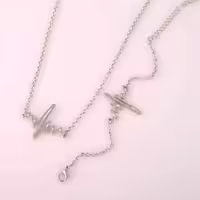 نیم ست گردنبند و دستبند طرح ضربان قلب با روکش نقره