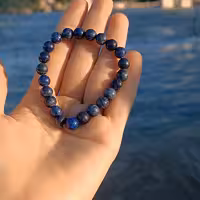 دستبند سنگ اصل  لاجورد افغان با کیفیت درجه یک و گره کشویی قابل تنظیم و امکان تبدیل به بند کشی در صورت تمایل شما 
