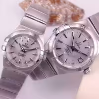 ساعتمچی ست مردانه و زنانه امگا بند استیل بدنه استیل رنگ نقره ای omega