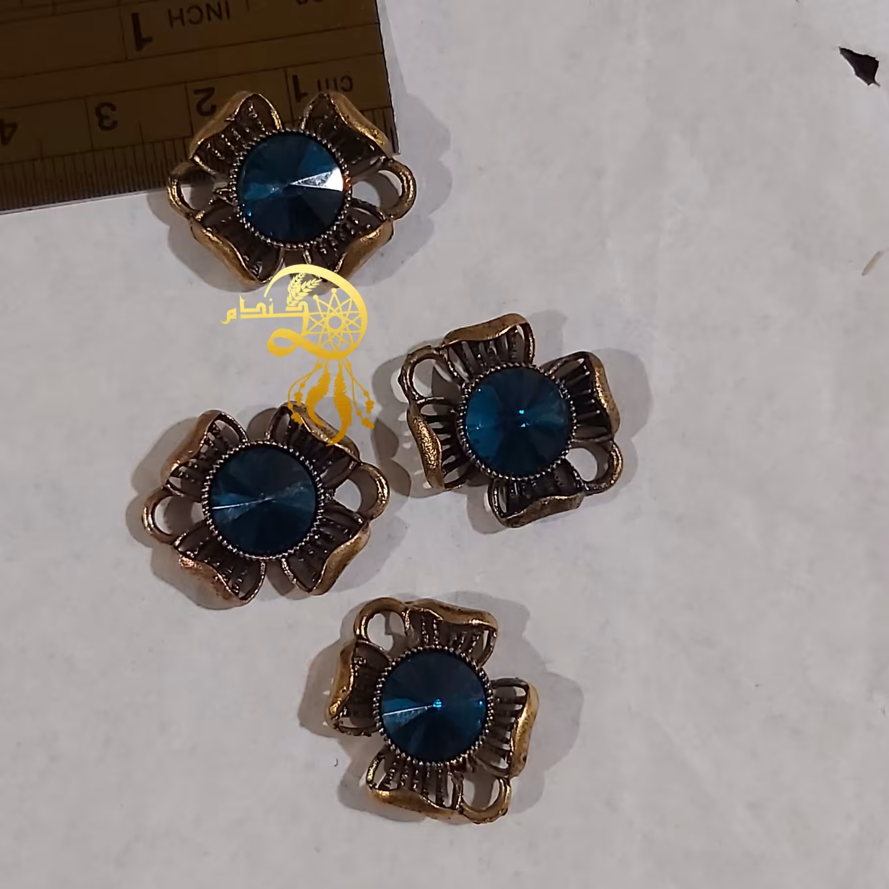 پلاک دستبندی طرح گل 2سانتی بانگین آبی تیره یک عدد