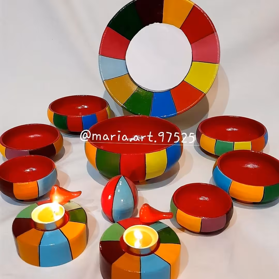 ست هفت سبن بارنگهای خیلی شادالبته به جای کاسه بشقاب هس وجاشمعی یه طرح دیگه موجودمیباشد