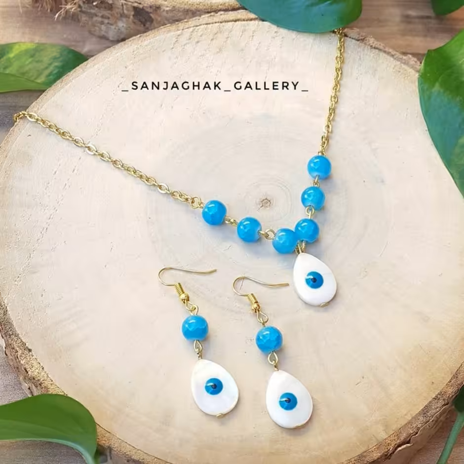 نیم ست استیل گردنبد و گوشواره پلاک صدف چشم نظر ابی