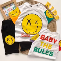 ست تیشرت و شلوارک اسپرت چاپ طرح لبخند  تک رنگ و سایز مختلف پنبه ای