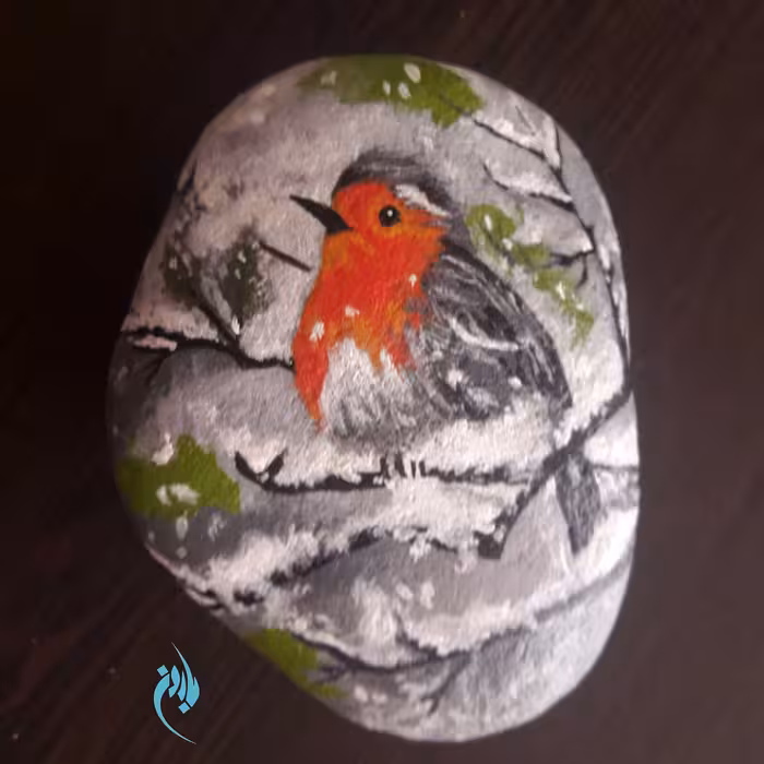 نقاشی روی سنگ طرح پرنده در برف
