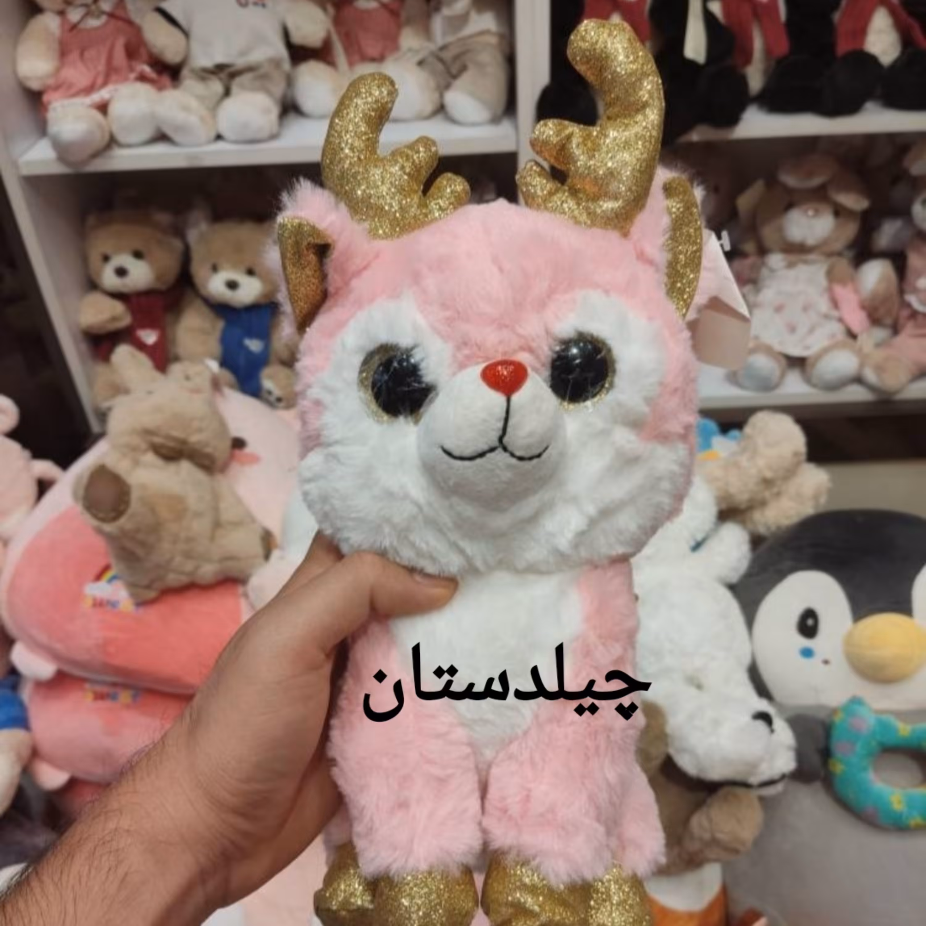 عروسک پولیشی گوزن شاخ طلایی رنگ صورتی 30 سانتی متر