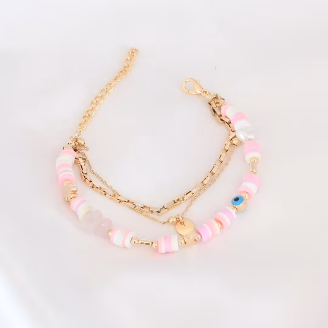 اکسسوری دستبند چشم نظری با مهرهای صورتی و سفید