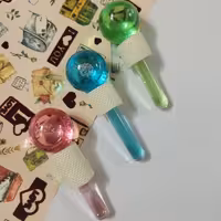 ماساژور دستی گوی یخی ( شیشه ای )  در سه رنگ سبز ، آبی ،صورتی 