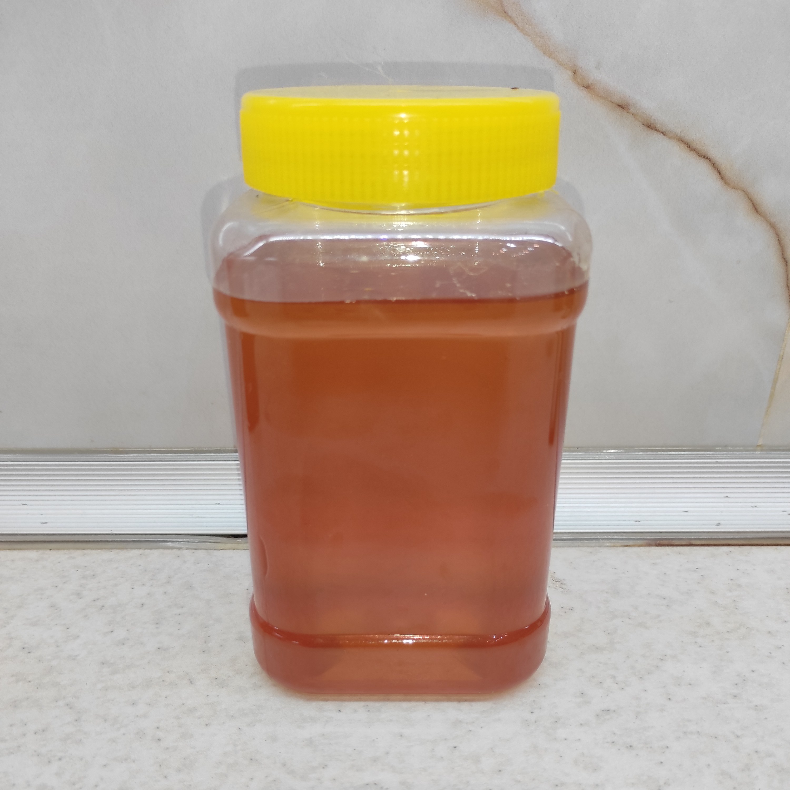 عسل طبیعی مرکبات نیم کیلو یی با ساکاروز پایین