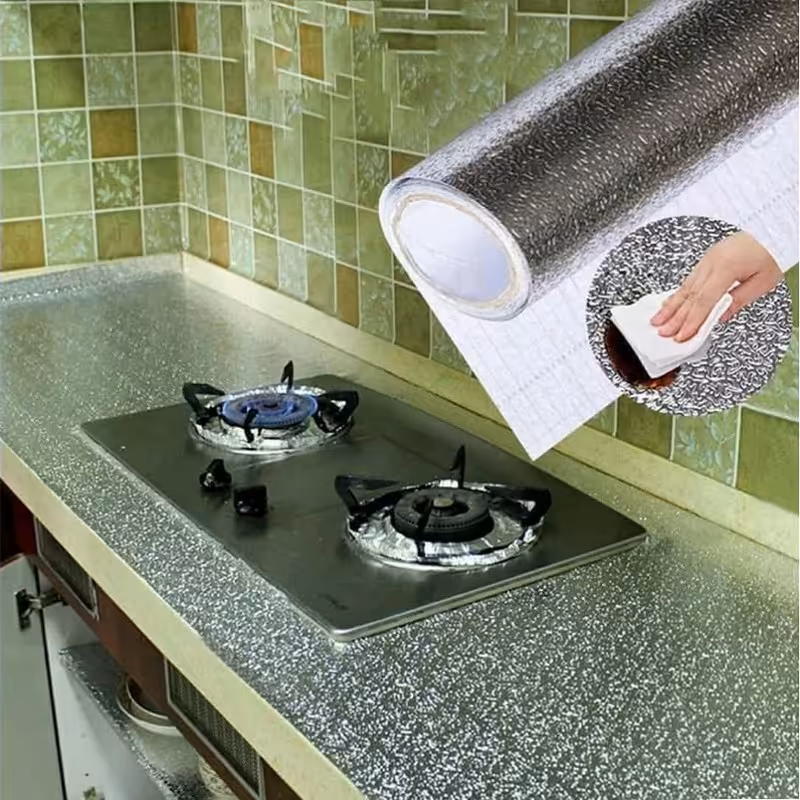 فویل چسبی رولی نسوز روکش کابینت  رنگ نقره ای 5 متری در عرض 60 مناسب برای داخل کابینت یخچال سرویس آشپزخانه 