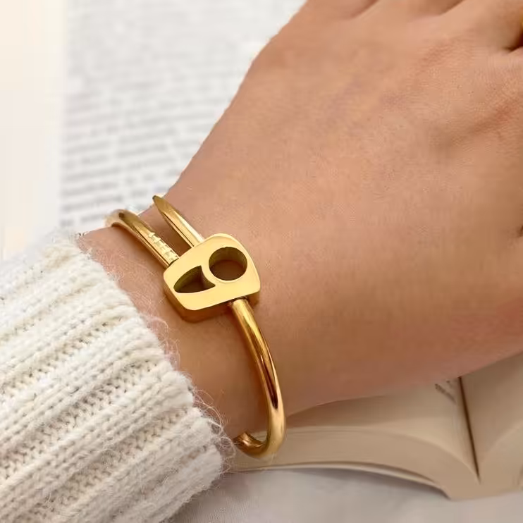 دستبند النگویی ه نیمانی استیل طلایی رنگ ثابت