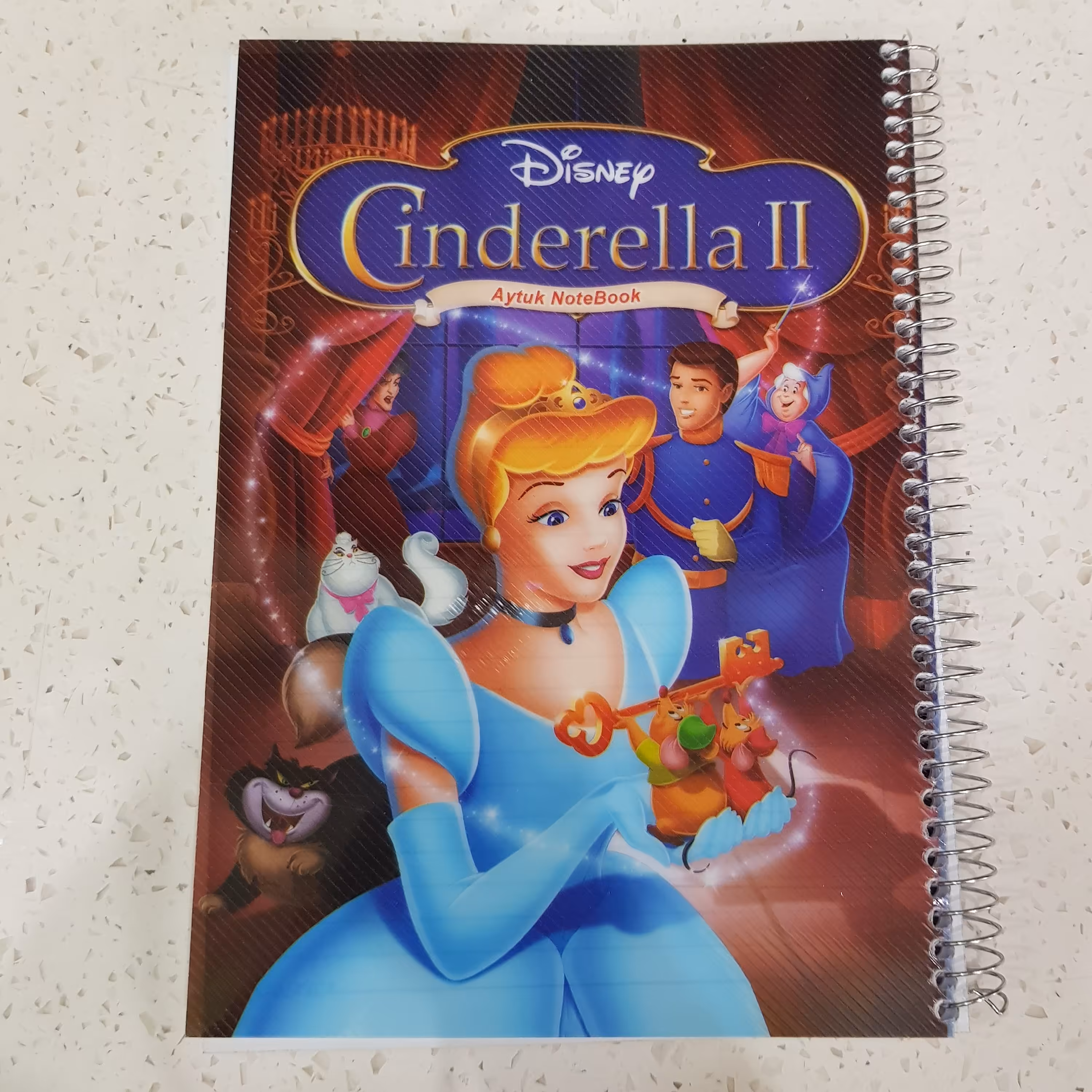 دفتر مشق 80 برگ طرح سیندرلا دفتر خط دار 80 برگ دفتر سیندرلا جلد طلقی برجسته سیمی شده