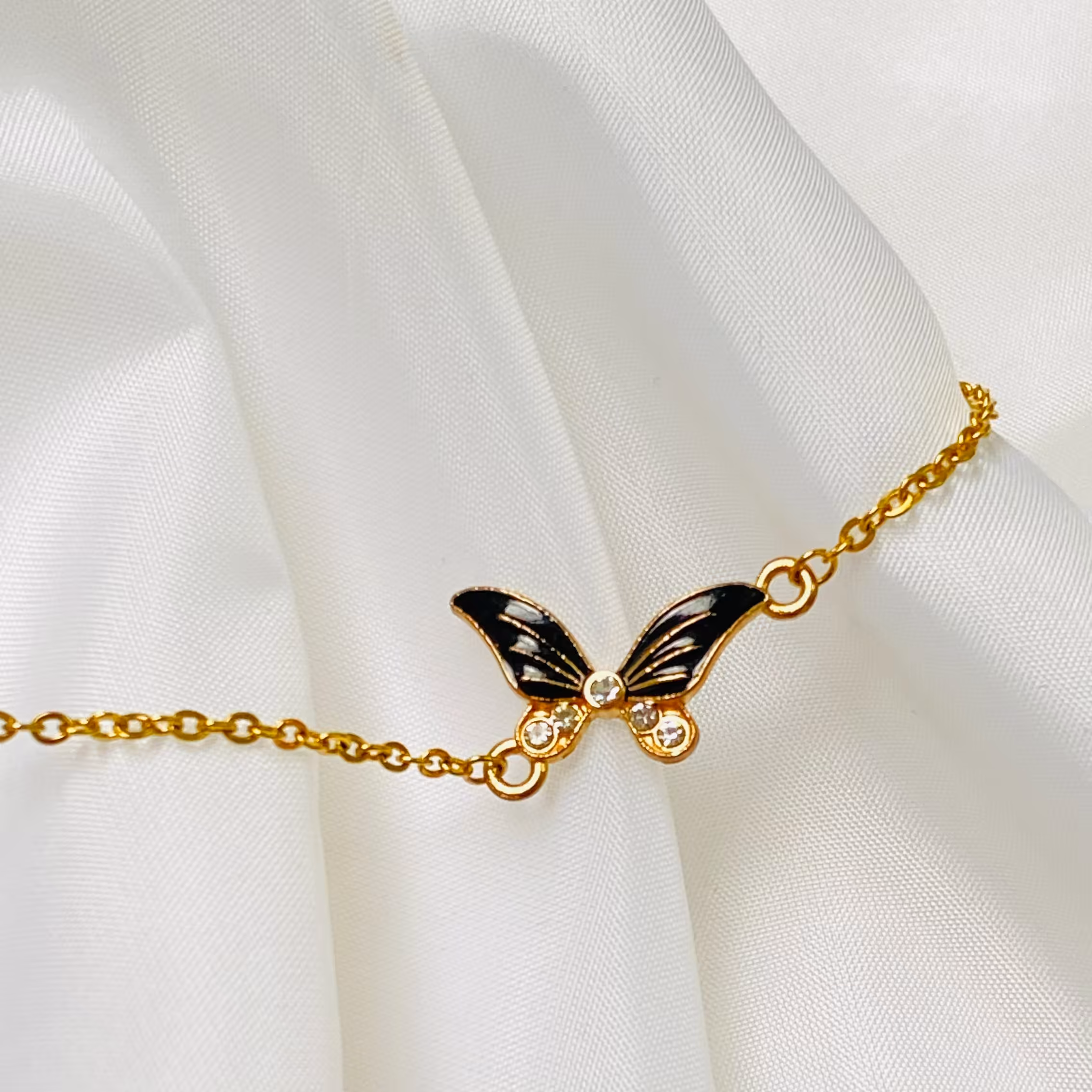 دستبند پروانه ای مشکی ظریف استیل