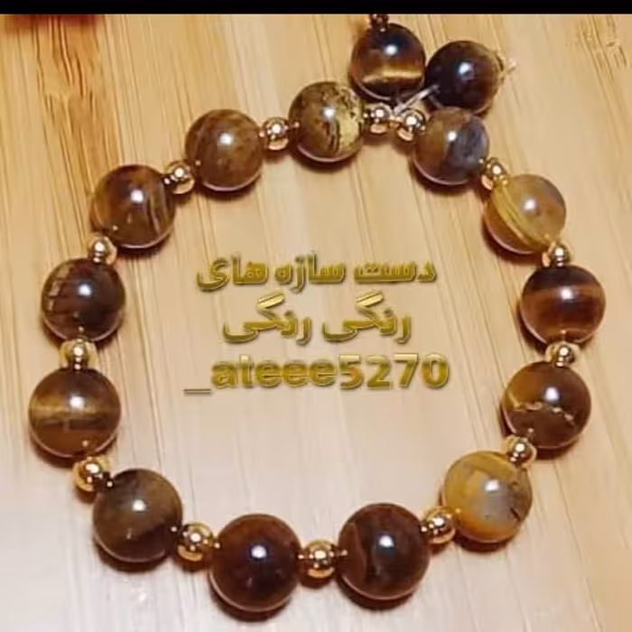 دستبند سنگ چشم ببر قهوه ای براق  سایز ده و سنگ حدید درجه یک 