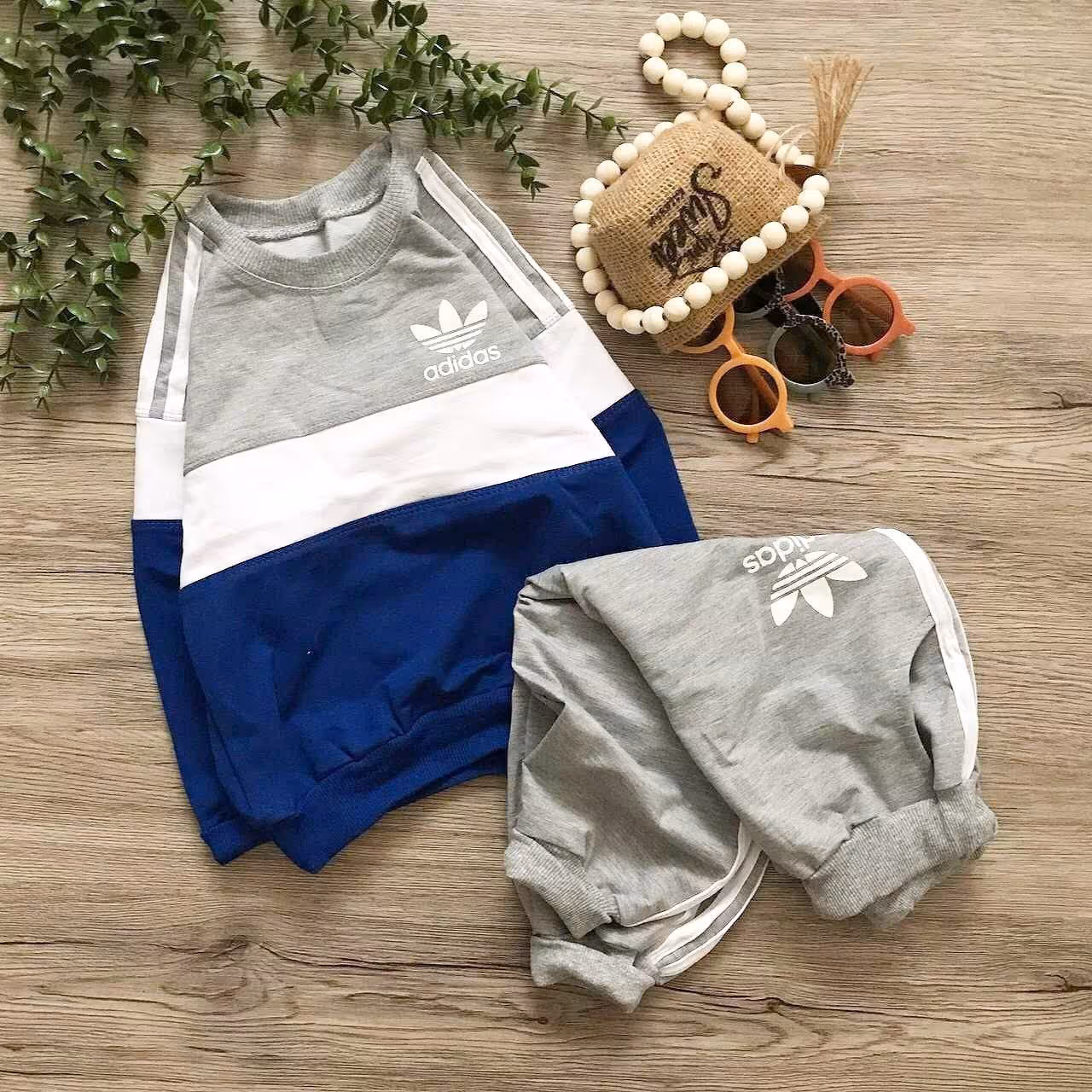 بلوز و شلوار اسپورت شیک طرح آدیداس مناسب حدود سنی 1 تا 13 سال جنس دورس لاکرا ملانژ