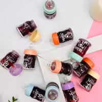 تینت لب شیشه شیر مجیک