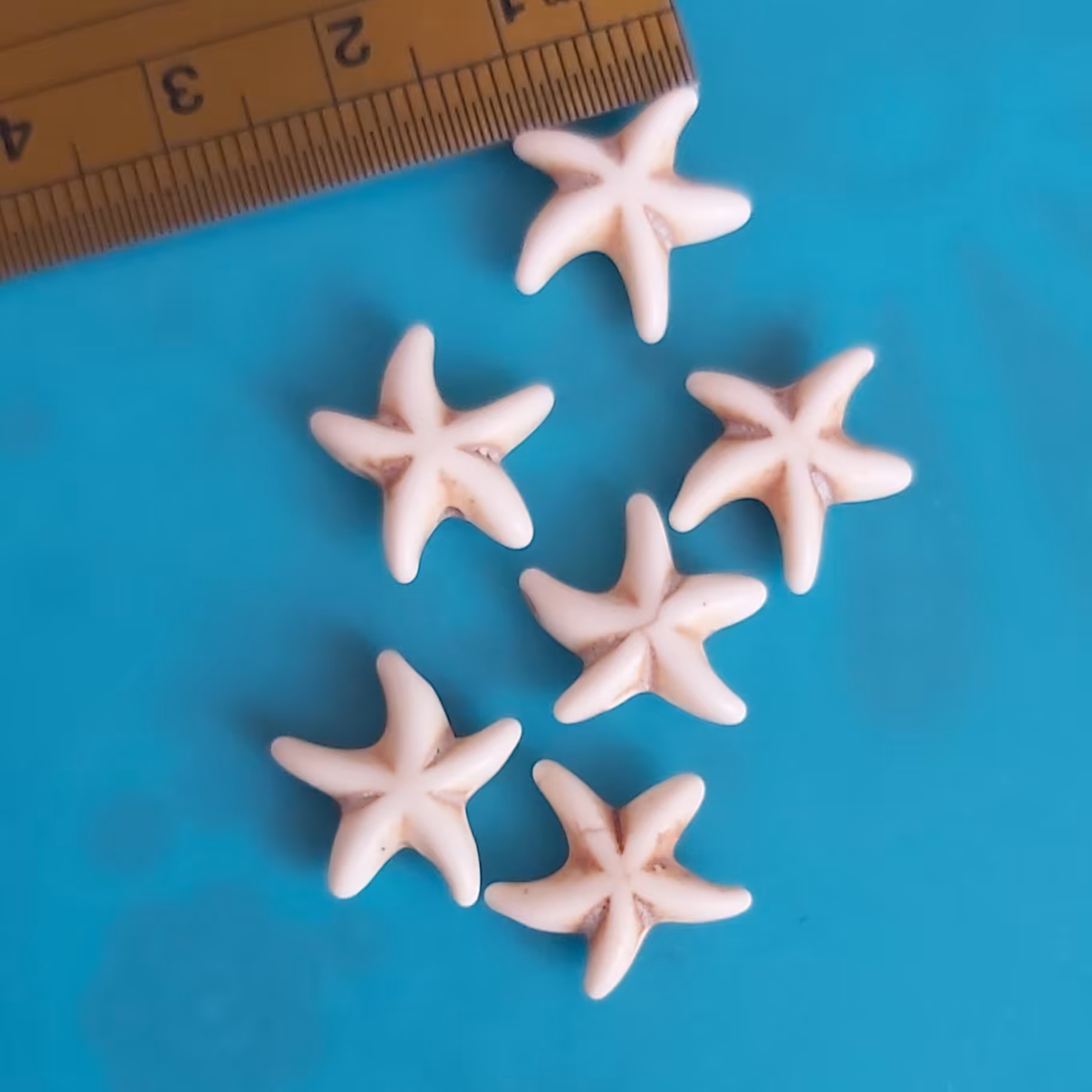 فیروزه کرم طرح ستاره دریایی یک سانت حدودا پک 5عددی