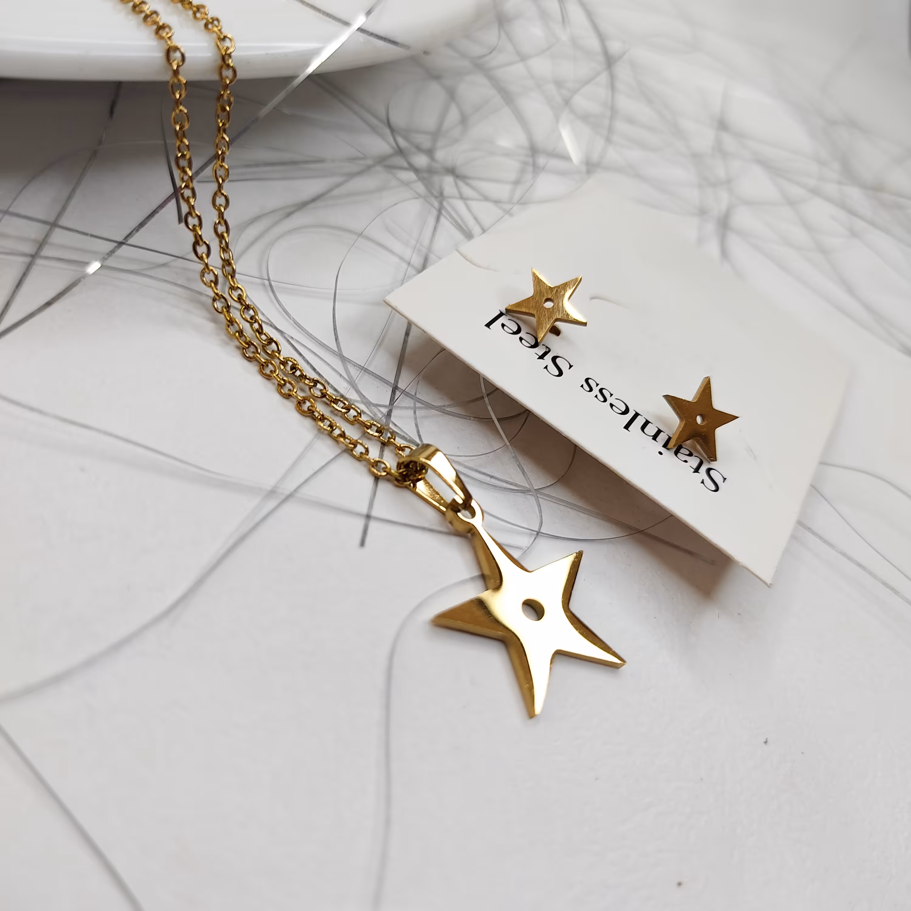 نیم ست گردنبند و گوشواره  طلایی استیل طرح ستاره