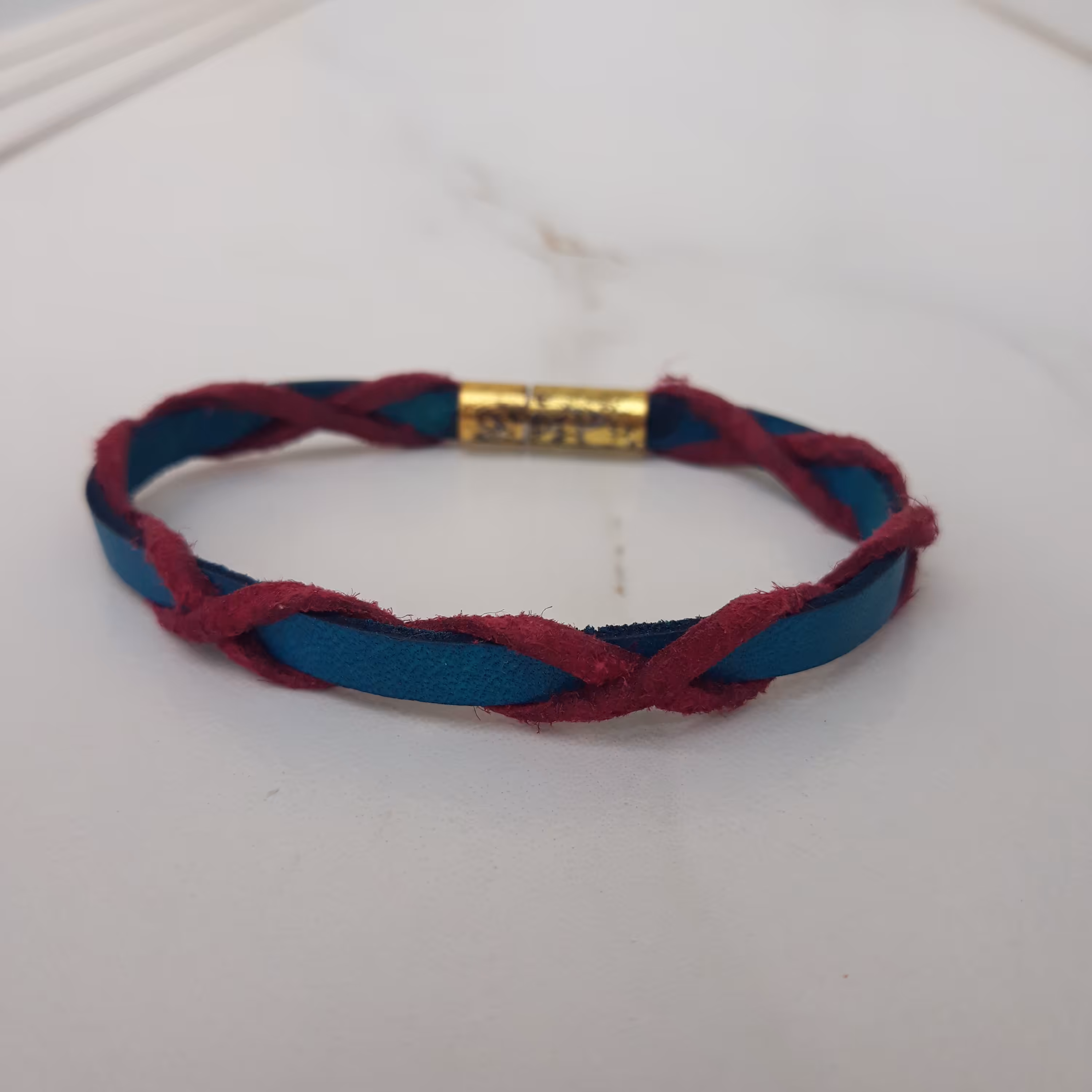 دستبند چرم آبی مدل ضربدر