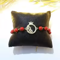 دستبند انار استیل طلایی رنگ ثابت و سنگ قرمز رگه دار