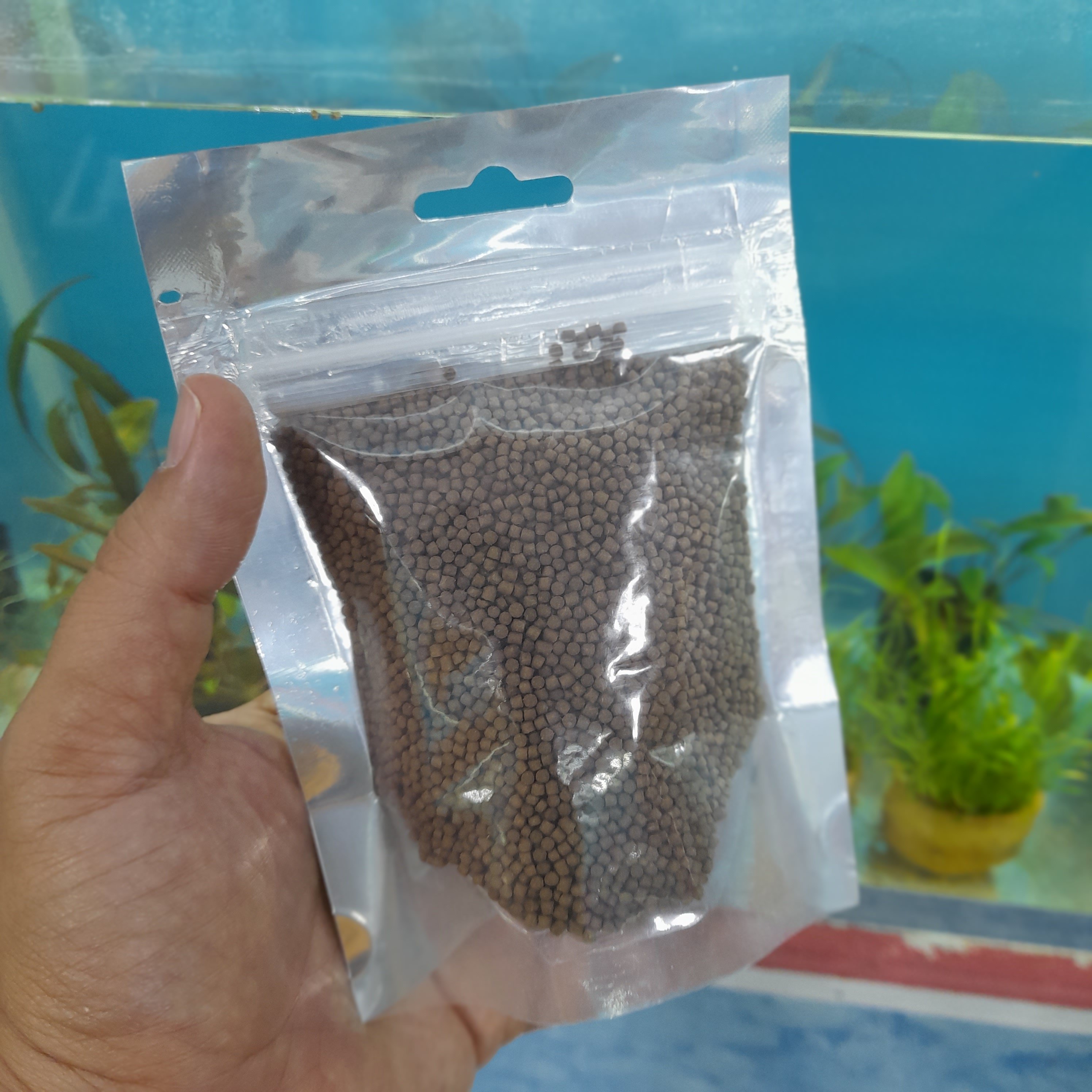غذای گرانولی زیرآبی ماهی آکواریوم (گوشت خوار 6تا14سانت) 100گرم سایز 2میل