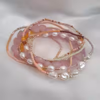 دستبند 7 عددی برند آی ام  رنگ صورتی