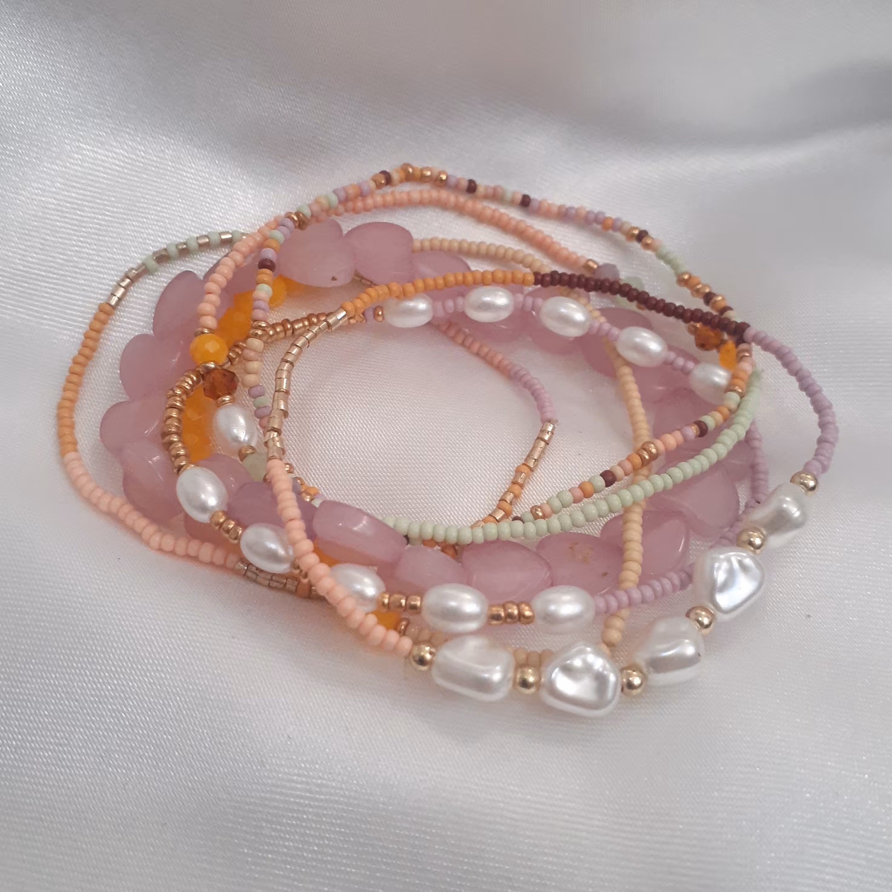 دستبند 7 عددی برند آی ام  رنگ صورتی