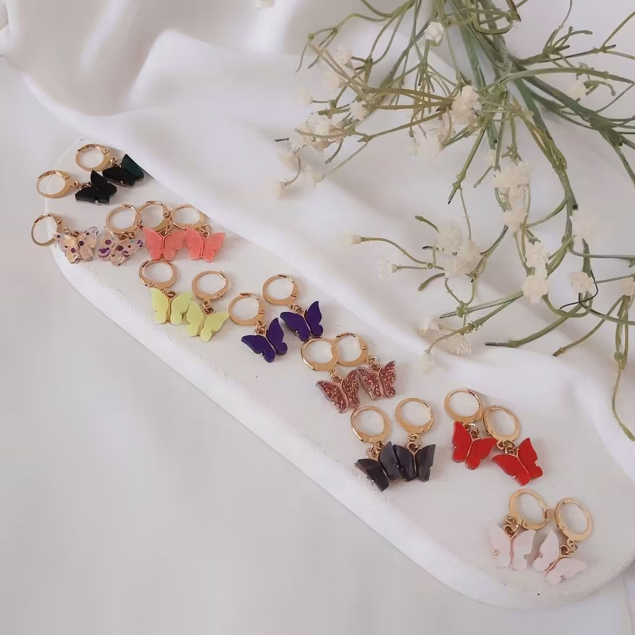 گوشواره پروانه رنگی دخترونه. جنس استیل. رنگ ثابت. با آویز پروانه رنگی .63