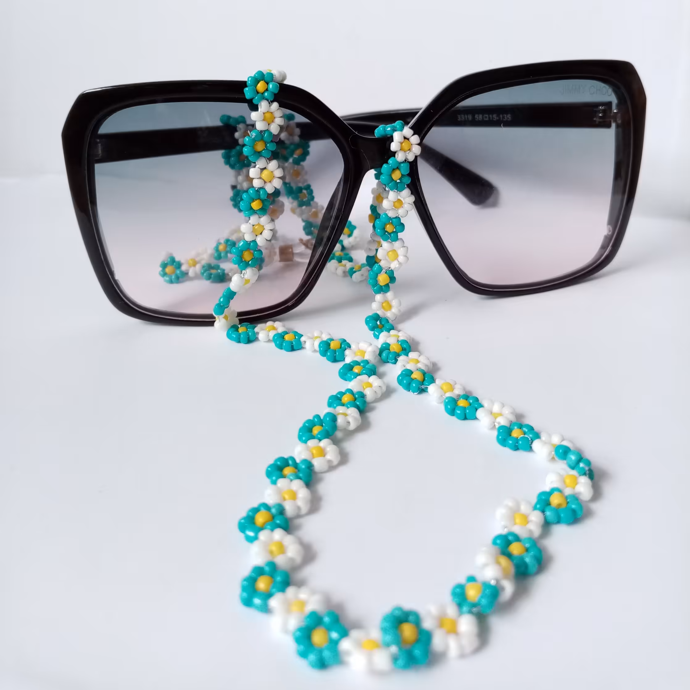 بندعینک منجوقی طرح بابونه فیروزه ای