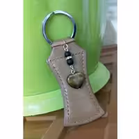 جاسوئیچی جذب ثروت چرم با آویز چشم ببر