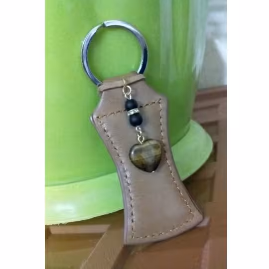 جاسوئیچی جذب ثروت چرم با آویز چشم ببر