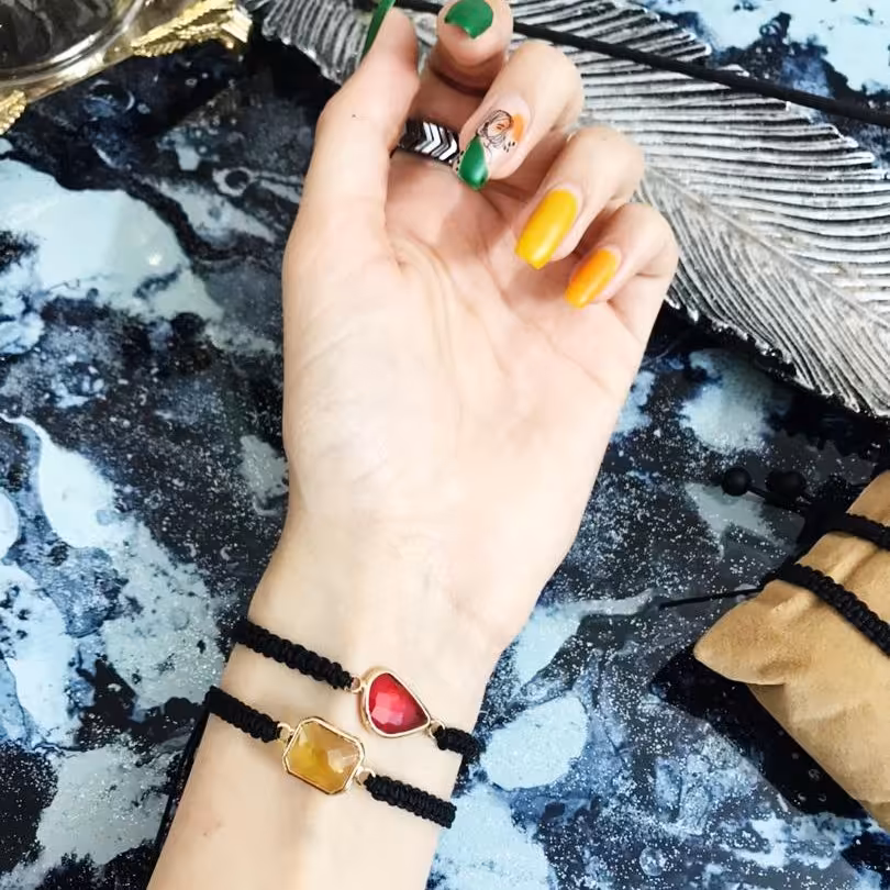 دستبند بافت با نیگن الماسی و صدف طلایی