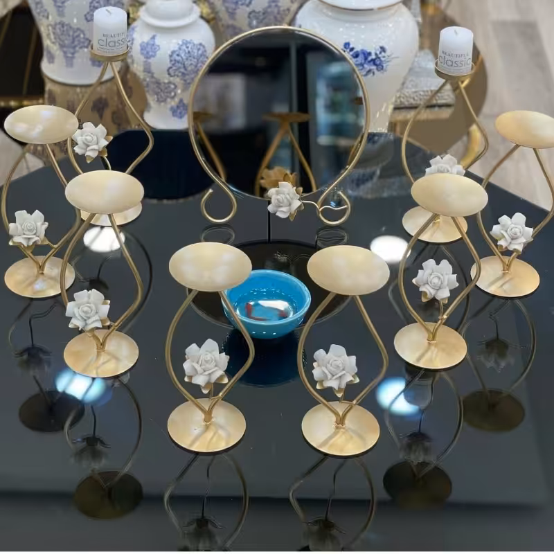 هفت سین طلایی گل چینی به همراه آینه و یک جفت شمعدان