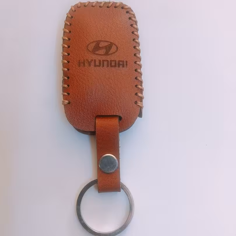 جاسوئیچی چرمی هیوندای کی لس 4دکمه آزرا و جنسیس لاکچری چرم