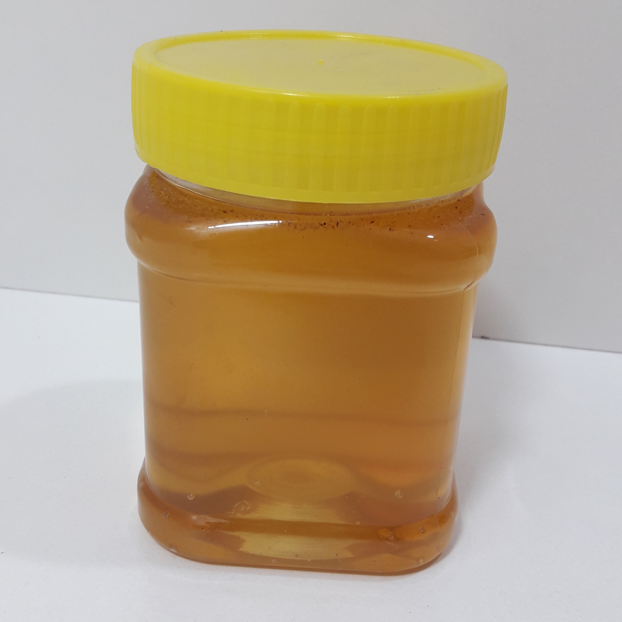 عسل طبیعی نیم کیلویی