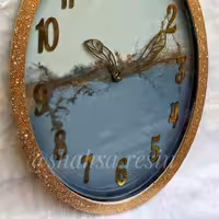 ساعت دیواری مدلی بیضی ابر و بادی