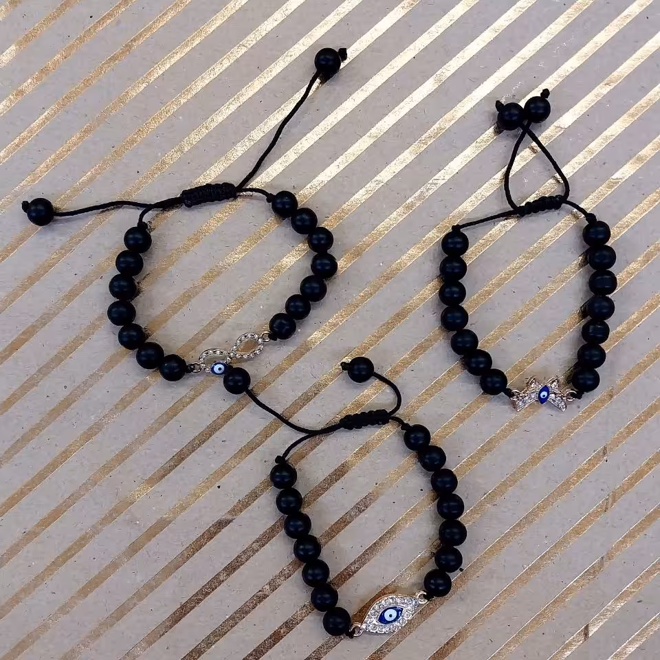 دست بند مرواریدی رنگ مشکی مات طرح چشم زخم