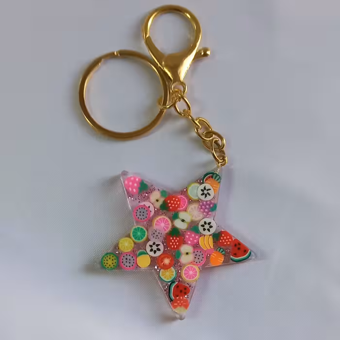 جاکلیدی و آویز کیف رزینی طرح ستاره تزئین شده با فیمو های میوه ای جذاب و ناز 