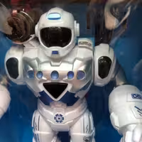 اسباب بازی ربات قهرمان موزیکال و چراغدار و تیر پرتابی مناسب برای بالای 6 سال