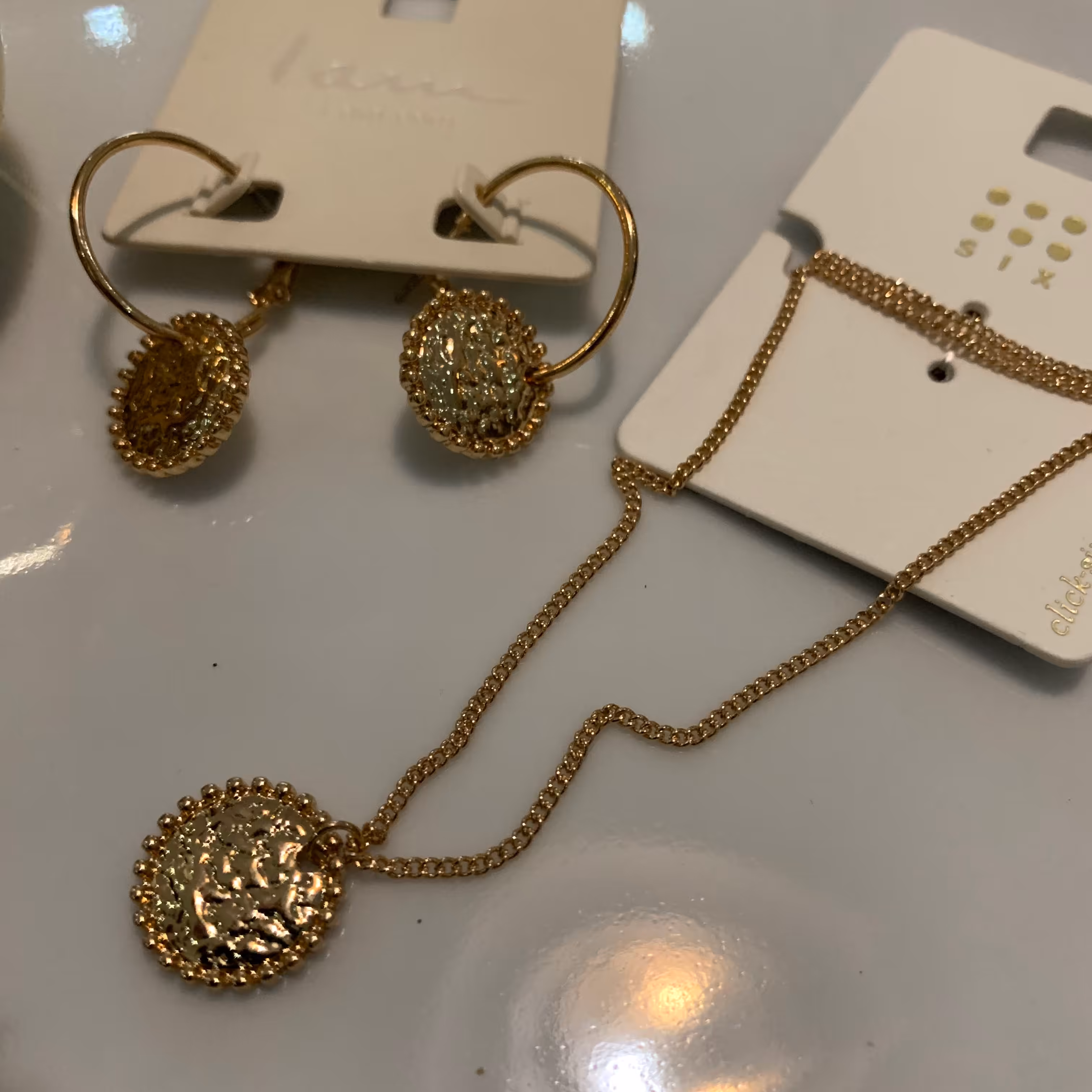 نیم ست خورشید طلایی شامل گردنبند و گوشواره برند آلمانی 