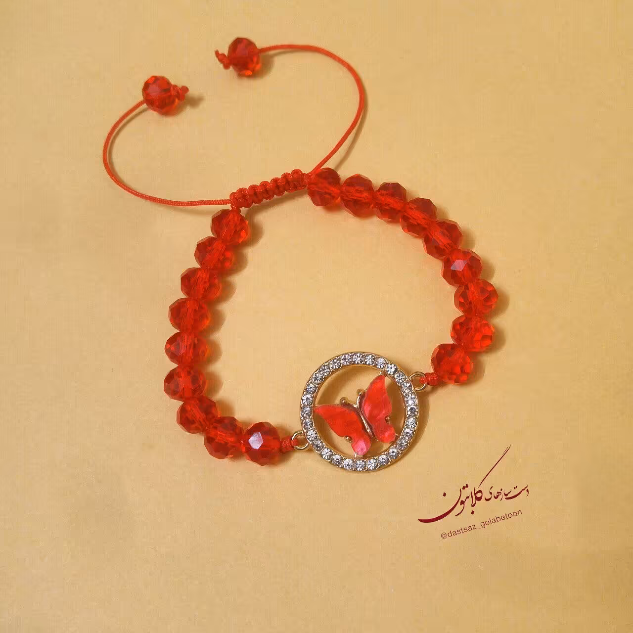 دستبند مجلسی پروانه قرمز نگین دار  و کریستال گلابتون