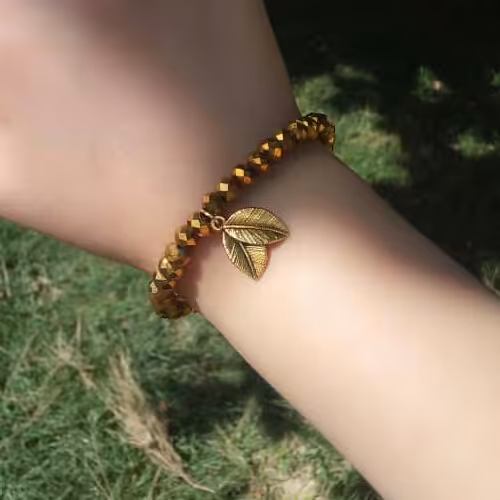 دستبند زنانه و دخترانه کریستال برگ طلایی نیل