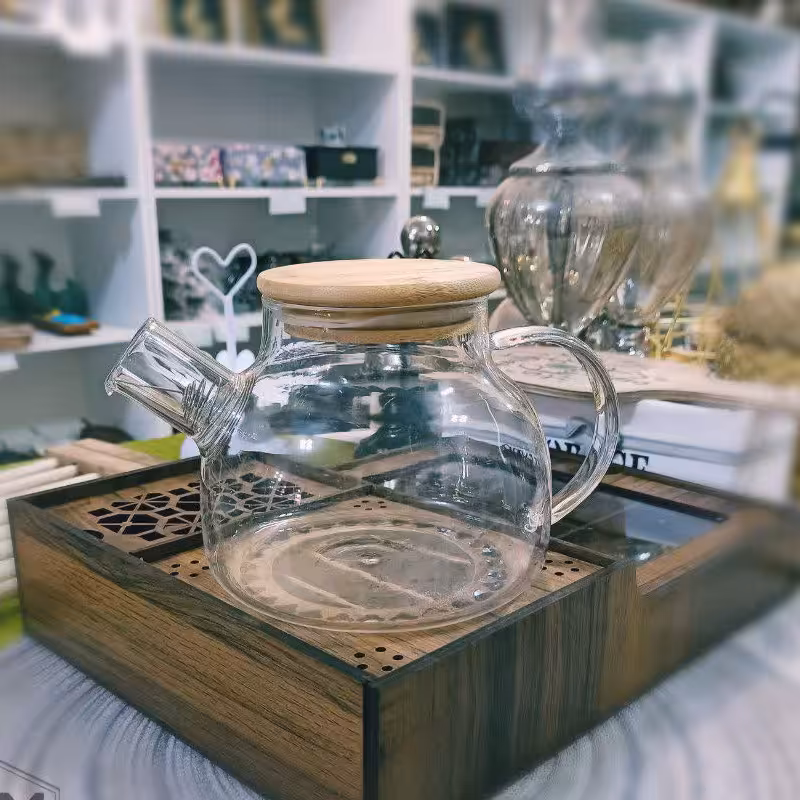 قوری پیرکس نشکن گرد با قابلیت گذاشتن روی شعله مستقیم درب بامبو جنس اصلی و ضخیم حجم  1200 میل