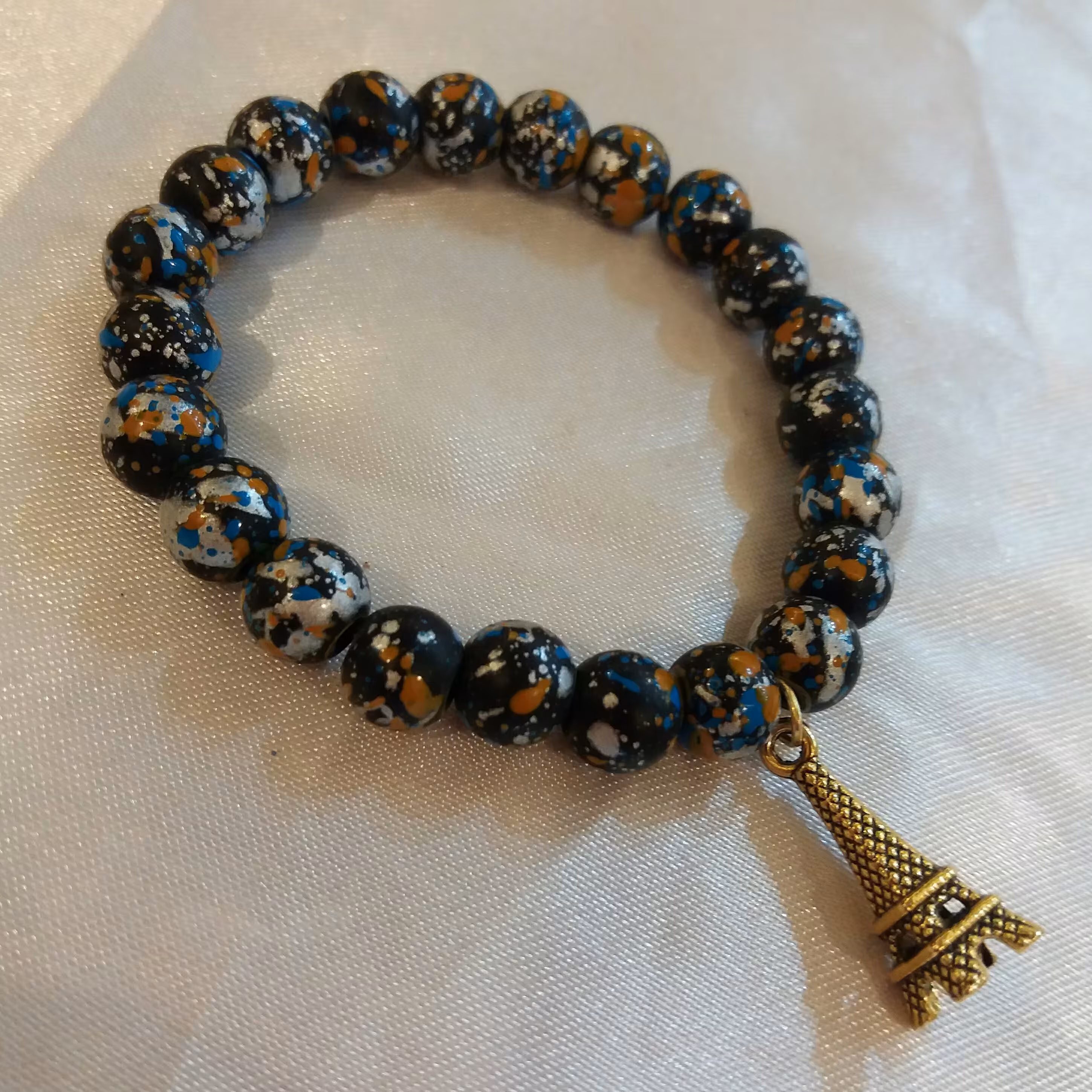 دستبند مهره ای طلایی آبی ساده