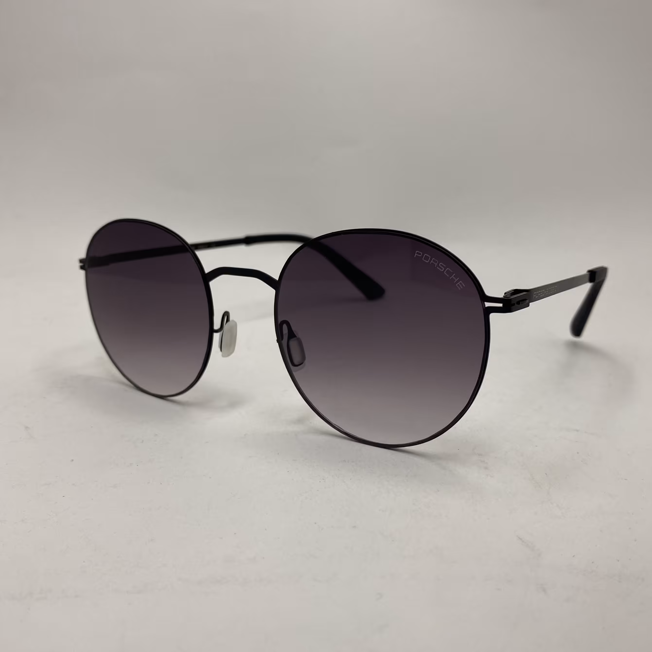 عینک آفتابی پورشه گرد مشکی بسیار سبک به همراه کاور  پارچه ای و دستمال مخصوص