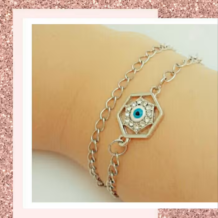 دستبند استیل دو ردیفه چشم نظر نگینی با قفل طوطی و رنگ ثابت